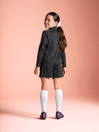 Poppy 1/4 zip girls training top black on pitch back 