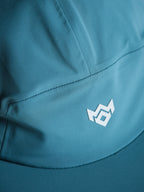 MissKick teal cap logo detail