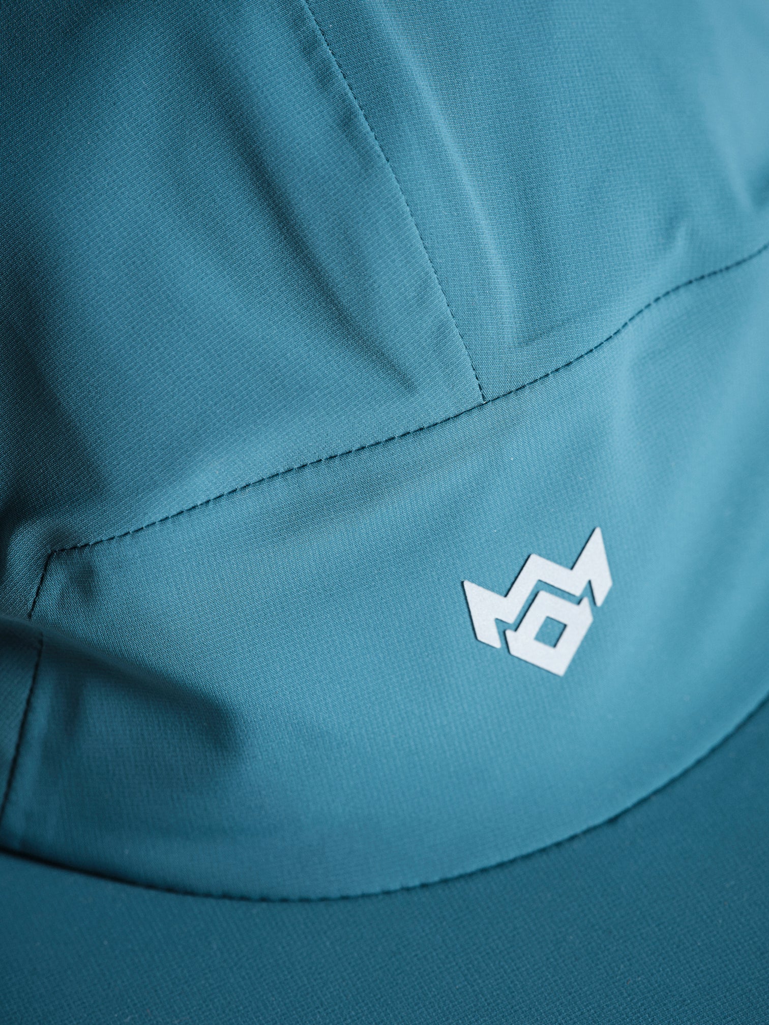 MissKick teal cap logo detail