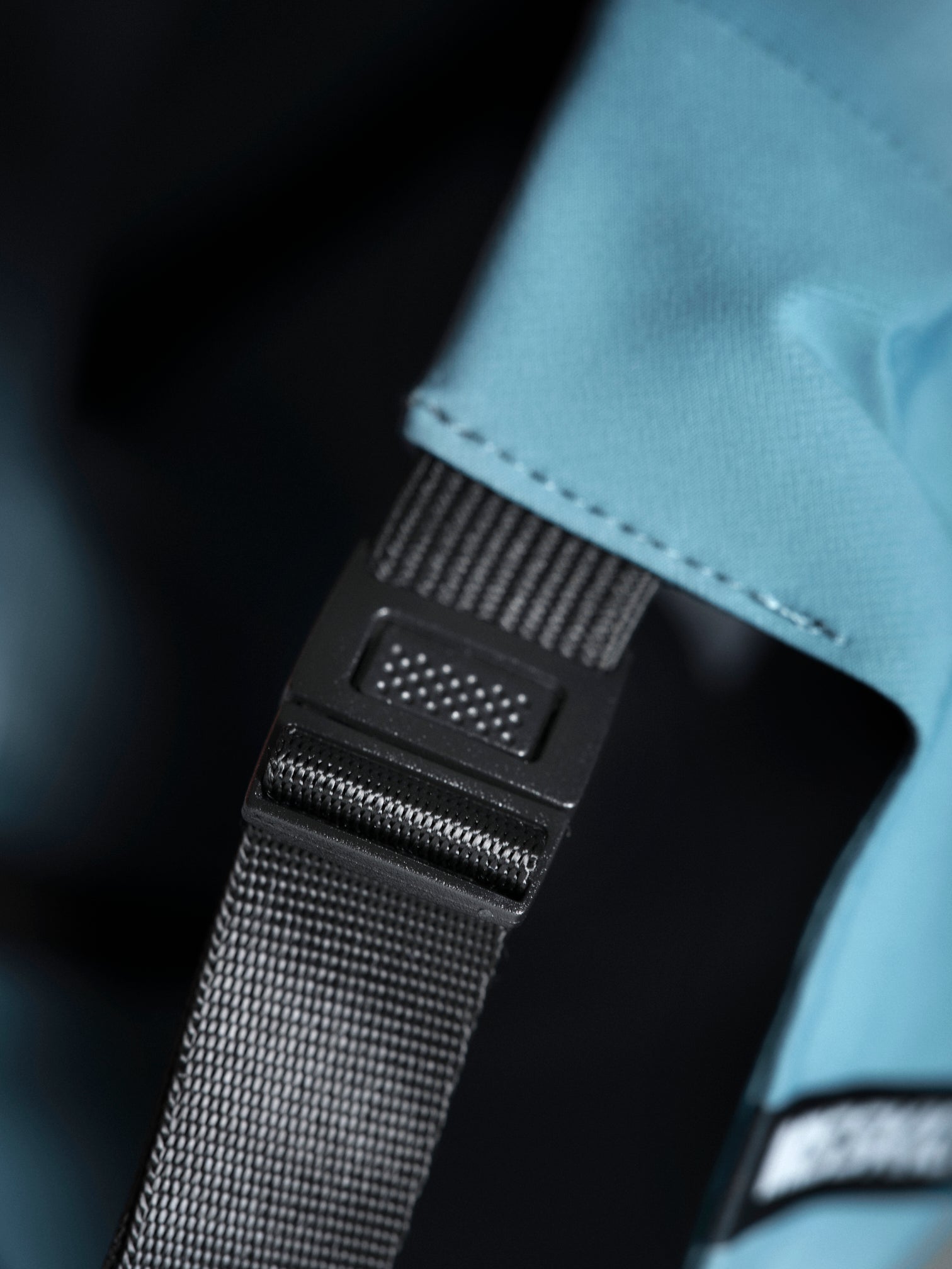 MissKick teal cap strap detail