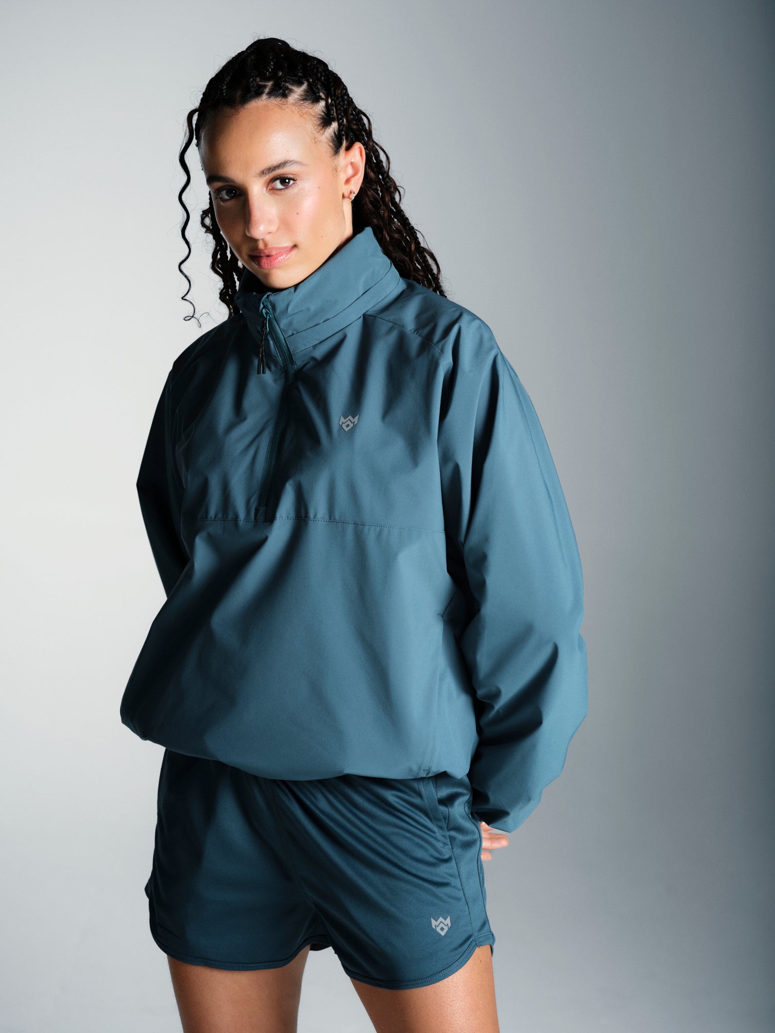 Misskick Tifoso wind breaker teal front